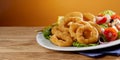 Golden fried calamari rings with fresh salad Royalty Free Stock Photo