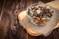 Golden fried forest mushrooms with onion in a bowl on wooden background