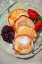 fried pancakes with strawberries and jam Royalty Free Stock Photo