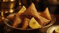 Golden Fried Pastry Triangles Served With Lemon Royalty Free Stock Photo