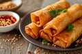 Golden fried spring roll served with a side of sauce