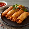 Golden fried spring roll served with a side of sauce