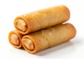 Golden fried spring rolls stacked on a white background Royalty Free Stock Photo