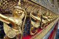 Golden garuda figures on exterior building of Wat Phra Kaew, Bangkok