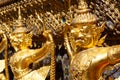 Golden garuda and naga statue, decoration on a wall of The Emerald Buddha temple, Wat Phra Kaew, Grand Palace, Bangkok, Thailand Royalty Free Stock Photo