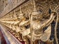 Golden garuda sculpture row around the church wall Royalty Free Stock Photo