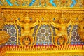 The golden Garudas on facade of Ubosot in Emerald Buddha Temple of Grand Palace in Bangkok, Thailand