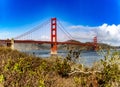 Golden Gate Bridge crossing the bay of the city of San Francisco, in the state of California in the USA, under a blue sky. Royalty Free Stock Photo