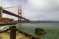 Golden Gate bridge with low fog rolling in San Francisco, California Royalty Free Stock Photo