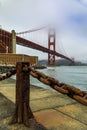 Golden Gate bridge with low fog rolling in San Francisco, California Royalty Free Stock Photo