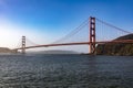 The Golden Gate Bridge in San Francisco over the bay of the Californian city under a blue sky and ocean. Famous bridge. Royalty Free Stock Photo