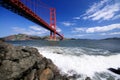 Golden Gate Bridge and surf on the rocks