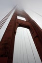 Golden Gate Bridge tower with fog rolling, San Francisco Royalty Free Stock Photo