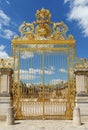 Golden gate of Chateau de Versailles with blue sky - Versailles, France Royalty Free Stock Photo