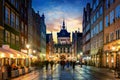 Golden Gate to the old town of Gdansk at night, Poland. Panoramic evening view, long exposure, timelapse. Historical city of Royalty Free Stock Photo