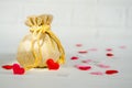 Golden gift bag and red hearts on white background, concept of gifts for lovers, for Valentine Day Royalty Free Stock Photo