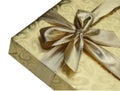 Golden gift box over white background. Inclined location, top view. Royalty Free Stock Photo
