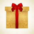 Golden gift box with red bow (ribbon). Present Royalty Free Stock Photo