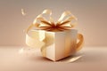 A golden gift box with a ribbon, gold luxury colour, with a ribbon tied around it. Royalty Free Stock Photo