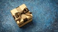 Golden gift box with shiny brown satin bow Royalty Free Stock Photo