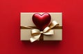 golden gift box and shiny red heart on it, seen from above Royalty Free Stock Photo