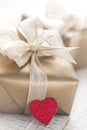 Golden gift boxes with beautiful ribbon and bow on a bright shiny background