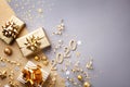 Golden gift or present boxes with golden bows, 2020 number and confetti top view. Christmas and New Year background. Flat lay Royalty Free Stock Photo