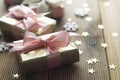 Beautiful golden gifts Christmas, party, birthday background. Celebrate shinny surprise boxes copy space wooden background