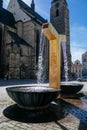 Golden gilded fountain and St. Bartholomew`s Cathedral in the main Republic square of Plzen in sunny day, Pilsen, Western Bohemia Royalty Free Stock Photo