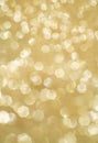 Golden giltter bokeh. Gold background for celebration card. Glowing backdrop.