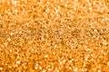 Golden giltter texture festive abstract background, workpiece for design, soft focus