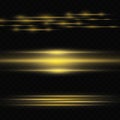 Golden glare on a transparent background. Light stripes on a dark background. Yellow rays