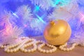 Golden glass Christmas bauble with natural pearl garland