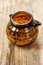 Golden glass lantern on wooden table