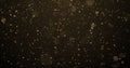 Golden glitter with bokeh light, gold particles splash on luxury black and gold background. Golden sparks splash, shimmer glow Royalty Free Stock Photo