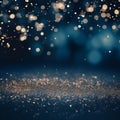 Golden glitter on a dark blue bokeh background. Winter seasonal, Christmas, and New Year celebration background design for a