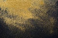 Golden glitter sand texture on black, abstract background. Royalty Free Stock Photo