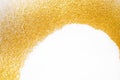 Golden glitter sand texture frame on white, abstract background. Royalty Free Stock Photo