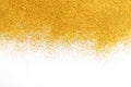 Golden glitter sand texture on white, abstract background. Royalty Free Stock Photo