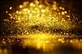 Golden glitter spatter are bokeh lighting texture blurred abstract background for anniversary celebration
