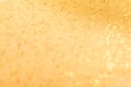 Golden glitter texture. Christmas expensive abstract background. Blured bokeh. Royalty Free Stock Photo