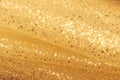 Golden glitter texture. Christmas expensive abstract background. Blured bokeh. Royalty Free Stock Photo