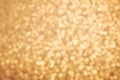 Golden glitter texture. Christmas expensive abstract background. Blured bokeh. Royalty Free Stock Photo