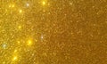 Golden glitter textured background,Bright beautiful shining golden glitter. Royalty Free Stock Photo