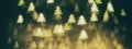 Golden glittering background with Christmas trees. Sparkle glitter texture with the bokeh and the lights Royalty Free Stock Photo