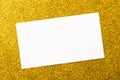 Golden glittering background and mock-up white paper Royalty Free Stock Photo