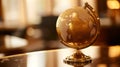 Golden Globe on Dark Reflective Surface Royalty Free Stock Photo