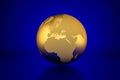 Golden globe showing Europe in front of blue background