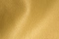 Golden Glossy Artificial Leather Background Texture Close-Up