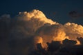 GOLDEN GLOW ON BILLOWING CUMULUS CLOUD Royalty Free Stock Photo